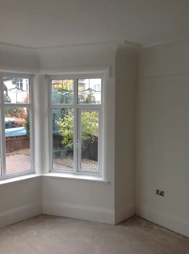 White bay window bedroom, freshly painted